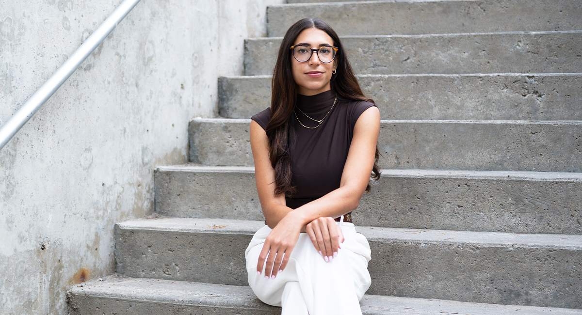 Portrait of a medical student sitting on outdoor concrete steps
